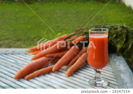 A glass of fresh carrot juice A glass of fresh carrot juice 18347554
