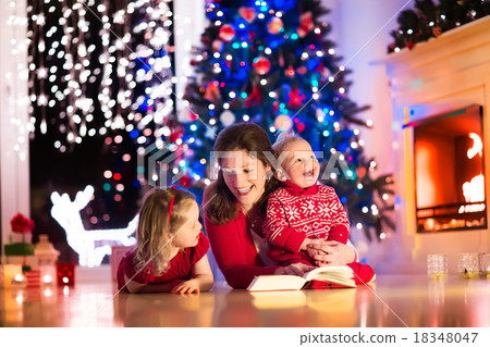 Mother and children at home on Christmas eve 18348047
