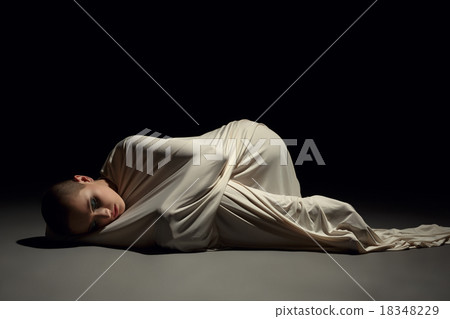 Studio image of mentally ill woman in straitjacket 18348229