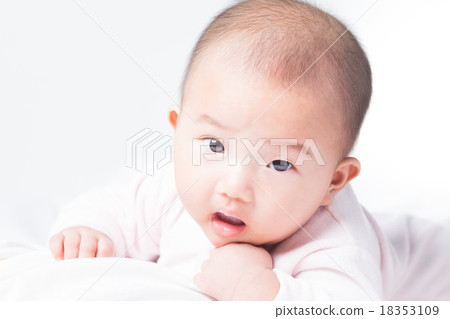 Adorable Asian baby 4-5 months old on white bed Adorable Asian baby 4-5 months old on white bed 18353109