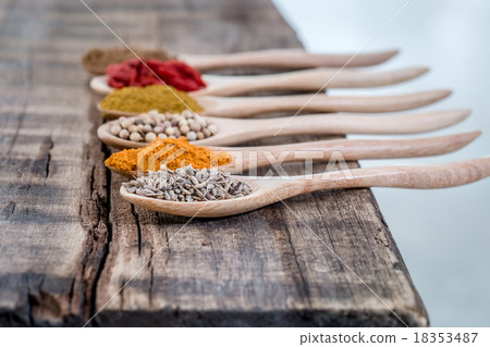 Collection of spices on a wooden spoon Collection of spices on a wooden spoon 18353487