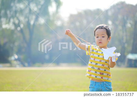 Child to skip paper airplane 18355737