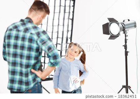 Young child model copies pose of the professional. Young child model copies pose of the professional. 18362451