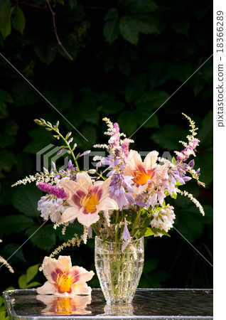 still life bouquet with hemerocallis in a dark 18366289