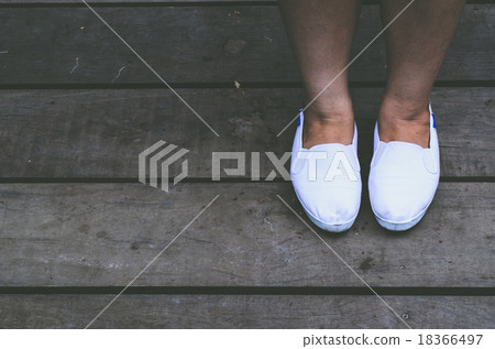women stand alone with white shoes on wooden way women stand alone with white shoes on wooden way 18366497