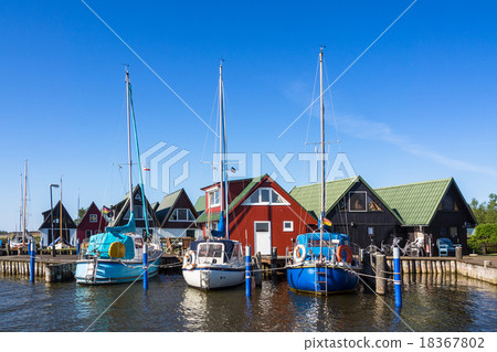 Boathouses and sailing ships in Ahrenshoop Boathouses and sailing ships in Ahrenshoop 18367802
