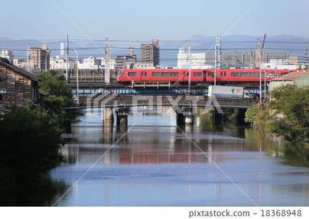 Meitetsu passenger passing through the bridge of the Nakagawa canal in Nagoya City Meitetsu passenger passing through the bridge of the Nakagawa canal in Nagoya City 18368948
