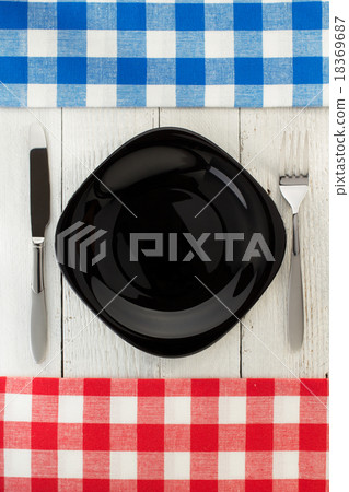 cloth napkin and plate on wood 18369687