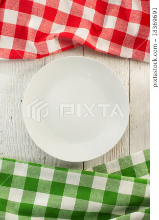 cloth napkin and plate on wood 18369691