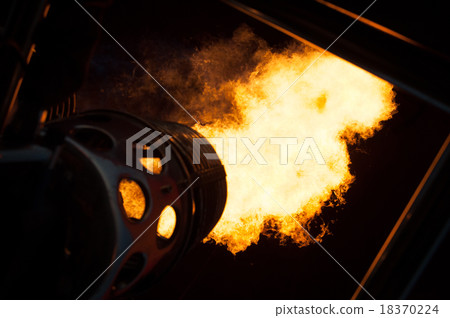 Flames in the night to heat up a hot air balloon. 18370224
