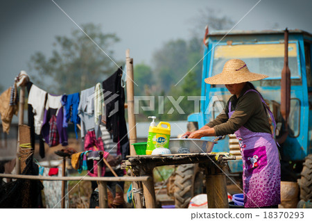 Asian woman washing clothes in Hsipaw Asian woman washing clothes in Hsipaw 18370293