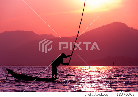 Silhouette of fisherman at sunset Inle Lake 18370365