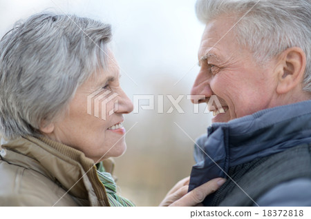 older couple on a walk older couple on a walk 18372818