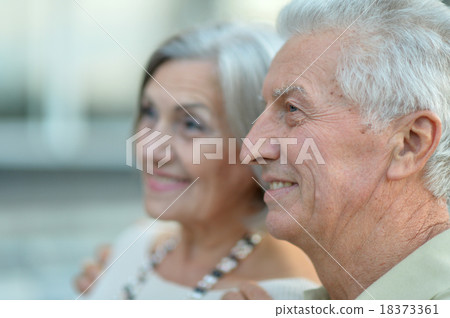 Happy nice mature couple walking Happy nice mature couple walking 18373361