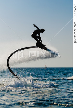 Silhouette of a hover board rider 18375273