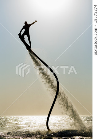 Silhouette of a hover board rider 18375274