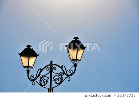 Street antique double lamp post and blue sky 18375715
