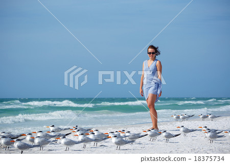 Young woman on Siesta Key beach, Florida  18375734
