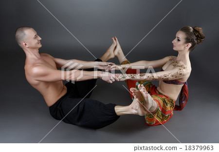 Yoga with partner. Trainers show one of asanas 18379963