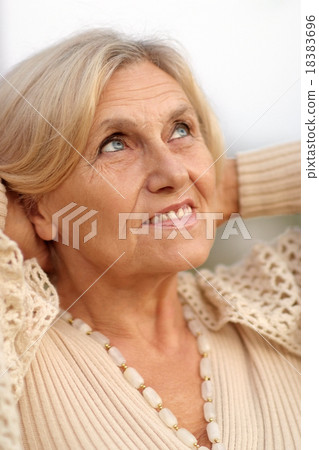 senior woman in summer park 18383696