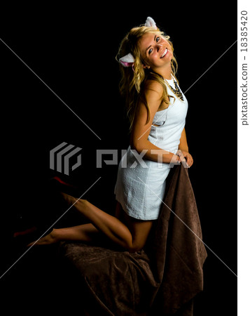 woman with cat ears. on black background woman with cat ears. on black background 18385420