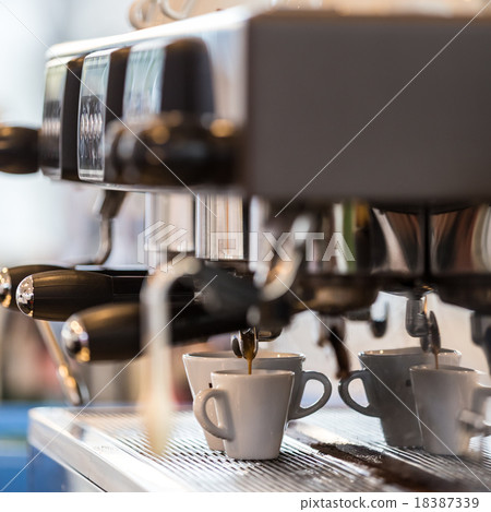 Professional coffee machine making espresso. 18387339