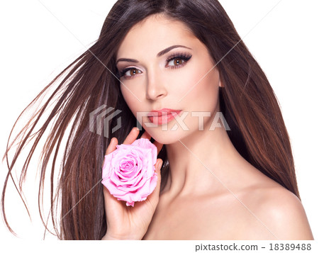 beautiful pretty woman with long hair and pink rose at face. beautiful pretty woman with long hair and pink rose at face. 18389488
