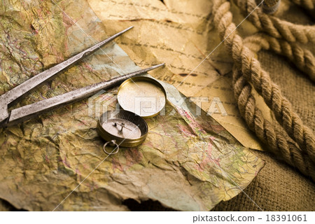 Compass on the old paper background Compass on the old paper background 18391061