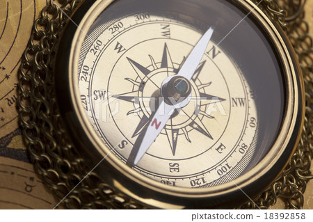 Detail closeup compass, ambient light travel theme 18392858