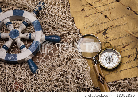 Detail closeup compass, ambient light travel theme 18392859