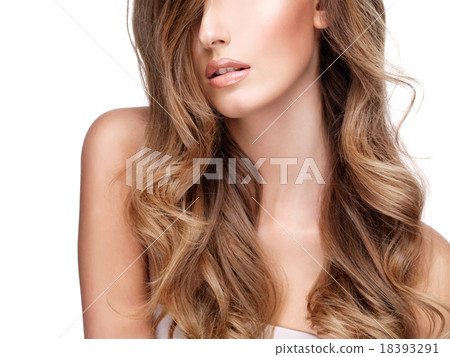 Beautiful long wavy hair of a pretty young woman 18393291