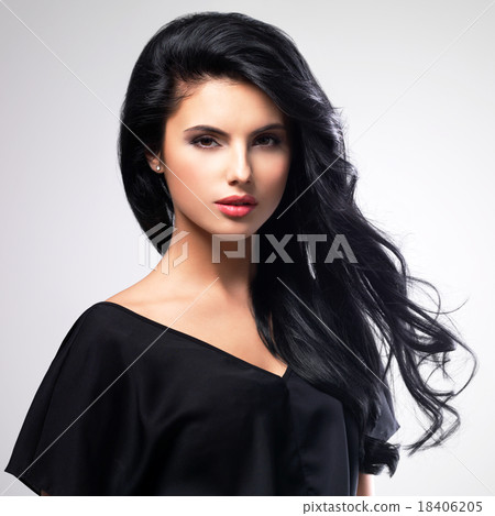 Portrait  of an young woman with long  hair. 18406205