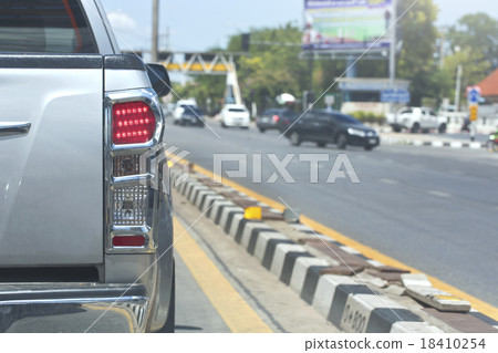 Truck Back light of city car on street. 18410254