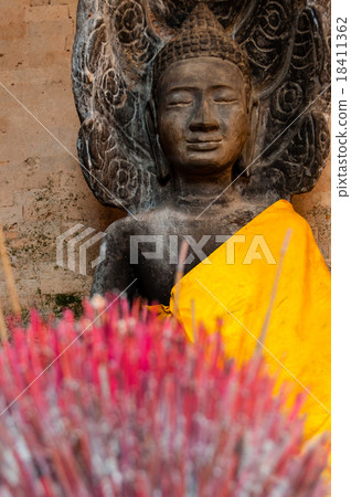 Incense sticks with Buddha in the back Incense sticks with Buddha in the back 18411362
