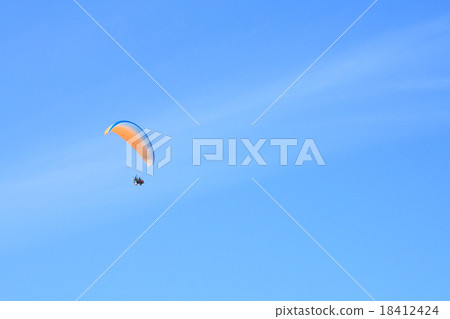 Motor paraglider and blue sky Motor paraglider and blue sky 18412424