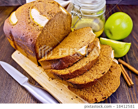 Bread apple with honey on dark board Bread apple with honey on dark board 18412581