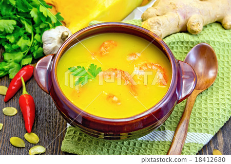 Soup-puree pumpkin with shrimps in clay bowl Soup-puree pumpkin with shrimps in clay bowl 18412680