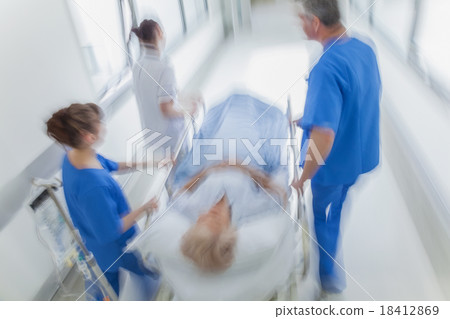motion blur senior female hospital gurney patient 18412869