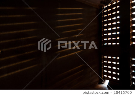 Light falling trough a window on wall 18415760