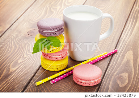 Colorful macaron cookies and cup of milk Colorful macaron cookies and cup of milk 18423879