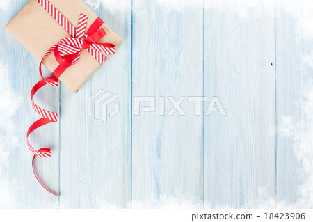Christmas gift box on wood Christmas gift box on wood 18423906