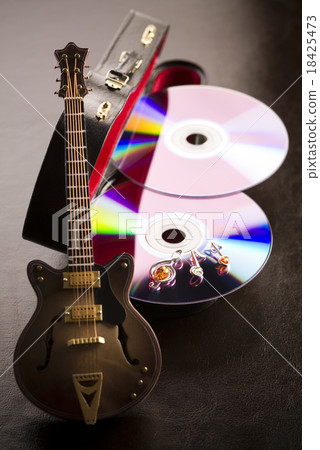 Guitar and CD, bright colorful vivid theme Guitar and CD, bright colorful vivid theme 18425473