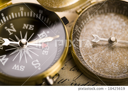 Compass on the old paper background Compass on the old paper background 18425619