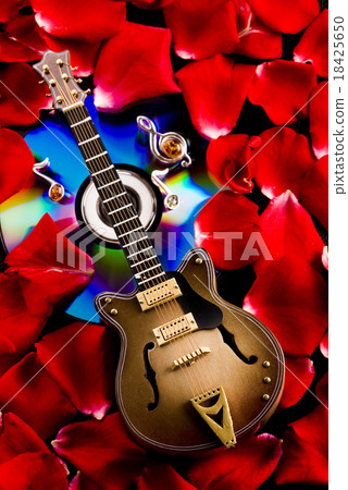 图库照片: guitar and cd, bright colorful vivid theme