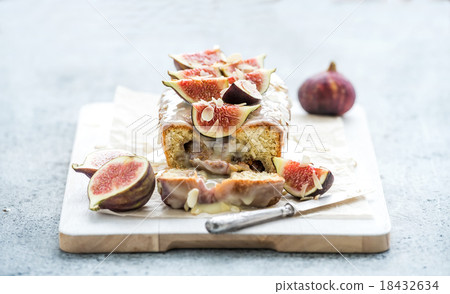 Loaf cake with figs, almond and white chocolate on 18432634