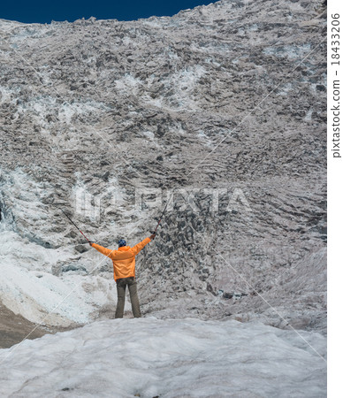 hiker looks at icefall 18433206
