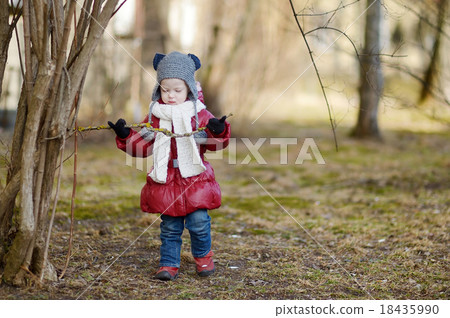 Adorable toddler girl having fun on spring Adorable toddler girl having fun on spring 18435990