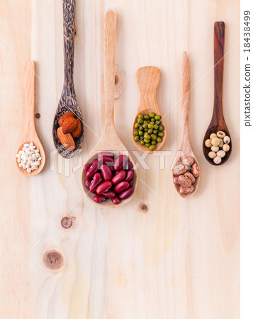 Assortment of beans and lentils in wooden spoon Assortment of beans and lentils in wooden spoon 18438499