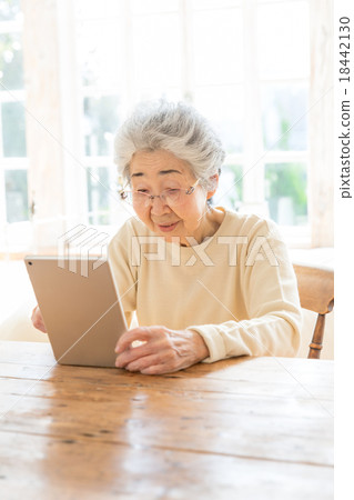 My grandmother using a tablet My grandmother using a tablet 18442130