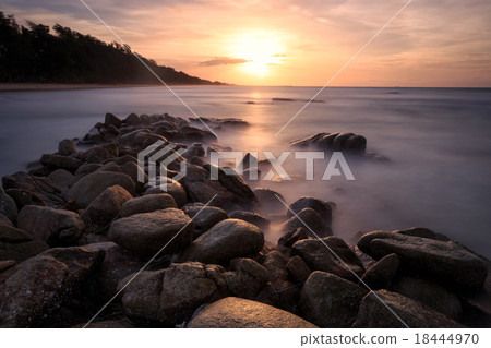 Beautiful sunset at the stone beach Beautiful sunset at the stone beach 18444970